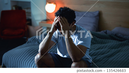 Insomnia, night and man in bedroom with fatigue for burnout, exhausted and stress for mental health. Tired, dark and person with upset, sad and anxiety for sleepless, bad dream and frustrated in home Insomnia, night and man in bedroom with fatigue for burnout, exhausted and stress for mental health. Tired, dark and person with upset, sad and anxiety for sleepless, bad dream and frustrated in home 135426683