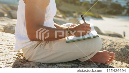 Hands, outdoor and writing with journal, plan personal development and goal setting for self awareness. Daily reflection, notes and person with diary, mindfulness activity or insight for inspiration. 135426694