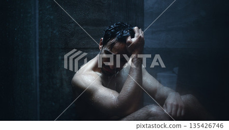 Man, shower and frustrated in bathroom for anxiety, mental health and reflection in home. Person with depression, house and running water for emotions, fear and disappointed with guilt or stress 135426746