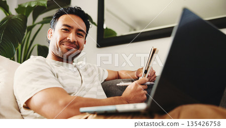Freelancer, portrait and man with laptop, home and journalism with notebook, confident and low angle. Creative, person and reporter with tech for story, remote work and pride for magazine publication 135426758