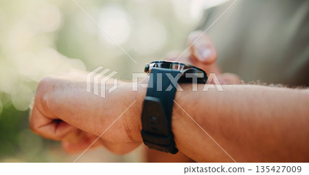 Checking, heart rate and hands with smart watch, outdoor and workout progress on fitness app or web. Park, wellness and person with tech for exercise update, scroll and health monitoring in nature Checking, heart rate and hands with smart watch, outdoor and workout progress on fitness app or web. Park, wellness and person with tech for exercise update, scroll and health monitoring in nature 135427009