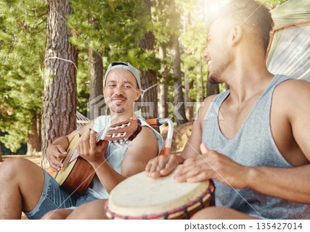 Musician, friends and camping with guitar, drum and together for music on summer, holiday in the woods or nature. Men, happiness and people playing or sing in musical performance, song or band Musician, friends and camping with guitar, drum and together for music on summer, holiday in the woods or nature. Men, happiness and people playing or sing in musical performance, song or band 135427014