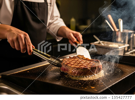 Chef grilling steak Chef grilling steak 135427777