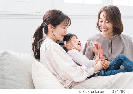A smiling three-generation family A smiling three-generation family 135428063