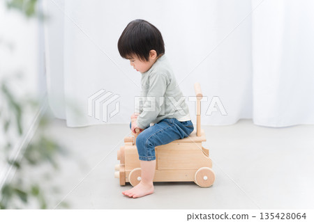 Child playing with toy car 135428064