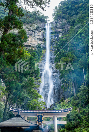 Kumano Hiro Shrine's torii gate and Nachi Falls Kumano Hiro Shrine's torii gate and Nachi Falls 135428316