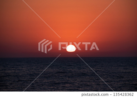 Deformed sunset on the horizon 135428362