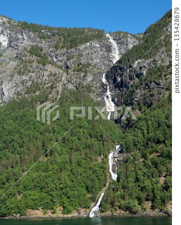 Waterfall in the valley of the Naeroyfjord in Norway Waterfall in the valley of the Naeroyfjord in Norway 135428679
