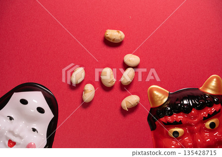 Setsubun with beans and demon mask photographed from above on a red background 135428715
