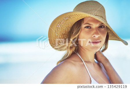 Travel, space and portrait of woman at beach for summer vacation, tropical and relax mockup. Wellness, nature and holiday with face of female tourist and hat at seaside for sunbathing and paradise 135429119