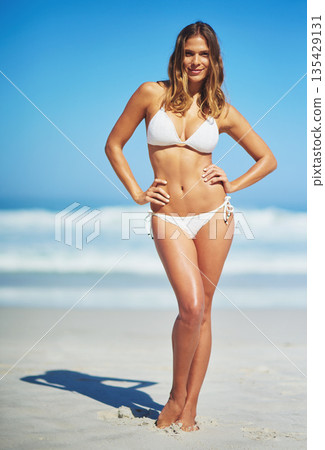 Body, portrait of woman in a bikini and at the beach with blue sky in Brazil. Freedom or adventure, summer vacation or holiday break and female person pose for swimwear or health wellness at the sea Body, portrait of woman in a bikini and at the beach with blue sky in Brazil. Freedom or adventure, summer vacation or holiday break and female person pose for swimwear or health wellness at the sea 135429131