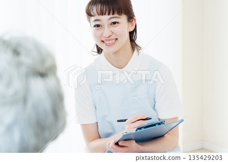 Caregiver talking to user Caregiver talking to user 135429203