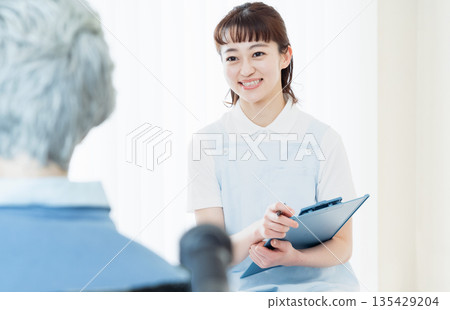 Caregiver talking to user Caregiver talking to user 135429204