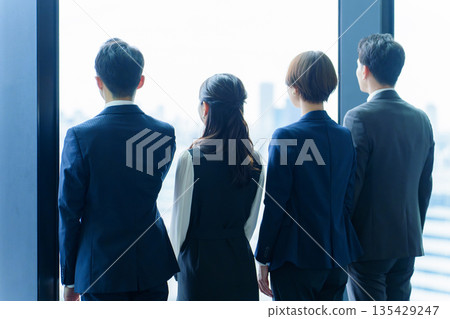 The back of a business person looking at the scenery The back of a business person looking at the scenery 135429247
