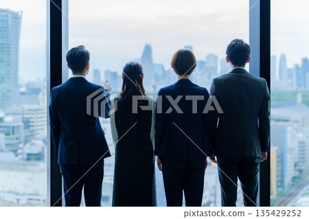 The back of a business person looking at the scenery The back of a business person looking at the scenery 135429252