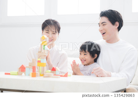 An image of a family nurturing children's curiosity and challenges 135429863