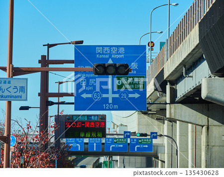 A sign pointing to Kansai Airport installed on a road in Izumisano City A sign pointing to Kansai Airport installed on a road in Izumisano City 135430628