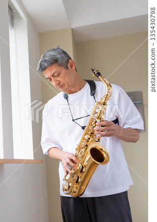 Senior men playing musical instruments 135430798