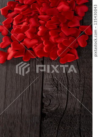 Red Hearts Scattered on Wooden Background Symbolizing Love and Passion. Valentines Day and Love Wallpaper Background. Red Hearts Scattered on Wooden Background Symbolizing Love and Passion. Valentines Day and Love Wallpaper Background. 135430843