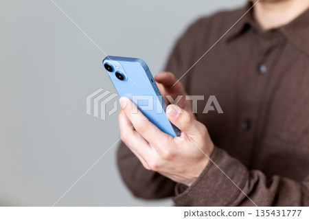 Male man who operates a smartphone Male man who operates a smartphone 135431777