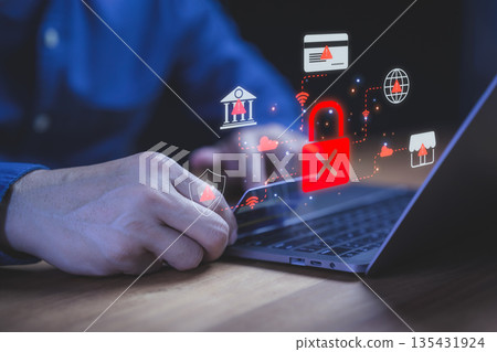 Cybersecurity concept showing data protection alert with red lock icon on laptop, representing online privacy risk, internet security breach, and protection against digital hacking and cyber threats. Cybersecurity concept showing data protection alert with red lock icon on laptop, representing online privacy risk, internet security breach, and protection against digital hacking and cyber threats. 135431924