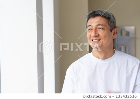 Smiling senior man relaxing Smiling senior man relaxing 135432536