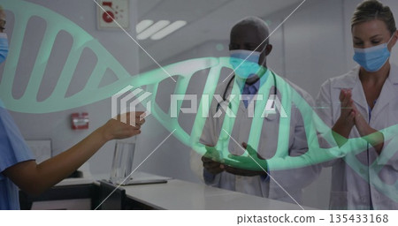 Sanitizing hands by masked team at reception desk with sanitizer bottle, stethoscope, DNA overlay Sanitizing hands by masked team at reception desk with sanitizer bottle, stethoscope, DNA overlay 135433168