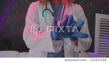 Medical professional pulling on blue glove in clinic room, with stethoscope lab coat scrubs Medical professional pulling on blue glove in clinic room, with stethoscope lab coat scrubs 135433169