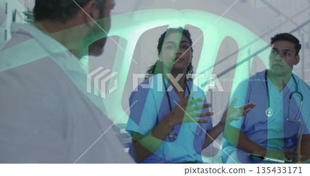 Gesturing nurse in blue scrubs explaining plan in hospital corridor, with stethoscopes clipboard 135433171
