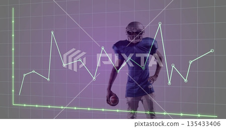 Standing football player holding football, wearing helmet and pads in studio, with graph overlay Standing football player holding football, wearing helmet and pads in studio, with graph overlay 135433406