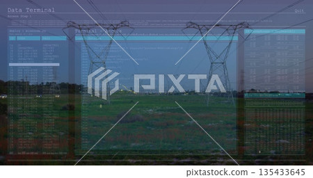 Standing central high-voltage tower carrying power lines across grassy field with code overlays 135433645