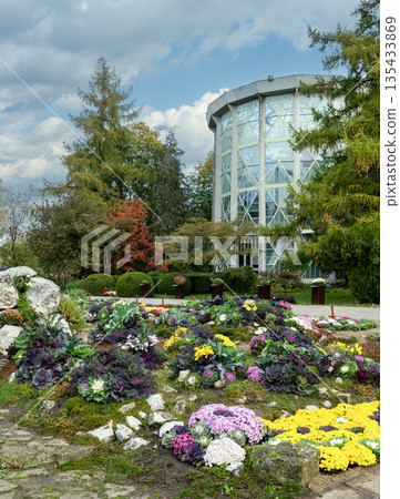 Modern Greenhouse And Colorful Flower Beds In Iasi Botanical Garden Modern Greenhouse And Colorful Flower Beds In Iasi Botanical Garden 135433869