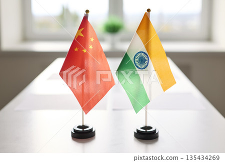 China and India miniature desk flags on conference table for diplomatic talks China and India miniature desk flags on conference table for diplomatic talks 135434269