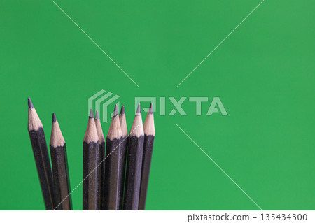 Black Pencils On Green Background 135434300