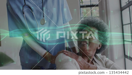 Ward nurse monitoring patient in wheelchair with stethoscope and digital data in clinic, copy space Ward nurse monitoring patient in wheelchair with stethoscope and digital data in clinic, copy space 135434442