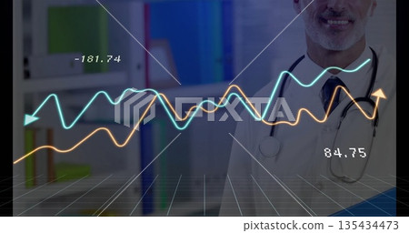 Standing doctor wearing lab coat and tie with stethoscope viewing line graphs in clinic, copy space Standing doctor wearing lab coat and tie with stethoscope viewing line graphs in clinic, copy space 135434473