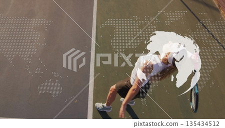 Serving athlete wearing cap skirt swinging racket overhead on court, world map overlay, copy space Serving athlete wearing cap skirt swinging racket overhead on court, world map overlay, copy space 135434512