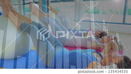 Crunching ab muscles, three women lying on stability balls in fitness studio, with data overlay Crunching ab muscles, three women lying on stability balls in fitness studio, with data overlay 135434535