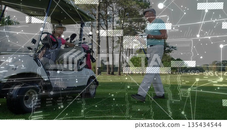Driving couple in golf attire in cart on fairway, with man checking smartphone by golf bag 135434544