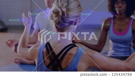 Sitting group of four wearing sportswear meditating in yoga studio, with mats and biometric overlay Sitting group of four wearing sportswear meditating in yoga studio, with mats and biometric overlay 135434789