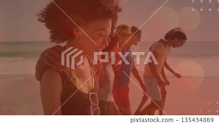 Walking seven friends in beachwear along beach shoreline at sunset, with sunglasses and lens flares Walking seven friends in beachwear along beach shoreline at sunset, with sunglasses and lens flares 135434869