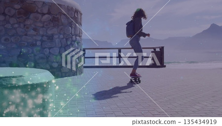 Skateboarding woman wearing jacket riding lakeside path with backpack by metal railing, copy space Skateboarding woman wearing jacket riding lakeside path with backpack by metal railing, copy space 135434919