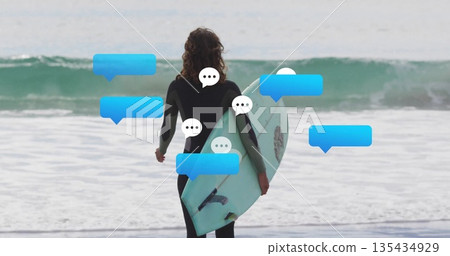Standing woman surfer holding light-blue surfboard at shoreline, with wetsuit and chat bubbles 135434929
