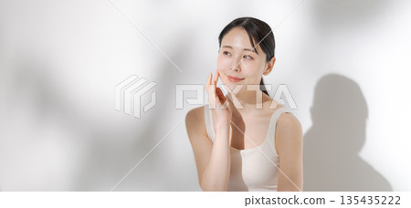 Young woman doing skin care (banner) Young woman doing skin care (banner) 135435222