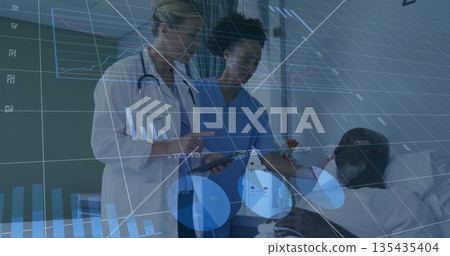 Doctor and nurse reviewing charts while patient reclining in bed in hospital room, with tablet Doctor and nurse reviewing charts while patient reclining in bed in hospital room, with tablet 135435404