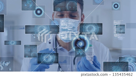 Clinician wearing mask and gloves preparing injection in lab, with syringe vaccine vial data panels 135435462