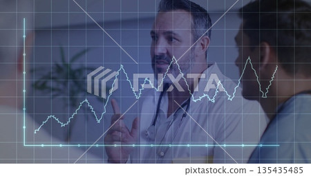 Pointing doctor with stethoscope viewing holographic chart in clinic, with colleague in blue scrubs Pointing doctor with stethoscope viewing holographic chart in clinic, with colleague in blue scrubs 135435485