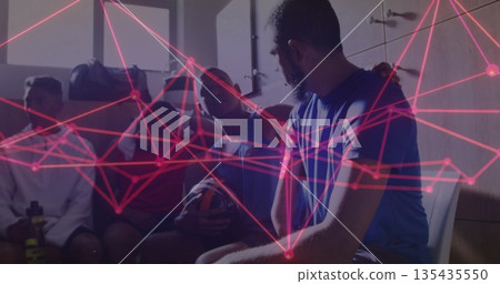 Sitting bearded man in blue shirt with teammates in locker room, football, neon overlay, copy space Sitting bearded man in blue shirt with teammates in locker room, football, neon overlay, copy space 135435550