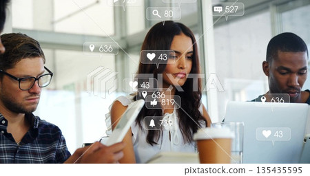 Collaborating woman in white blouse reviewing project in conference room, media icons floating Collaborating woman in white blouse reviewing project in conference room, media icons floating 135435595