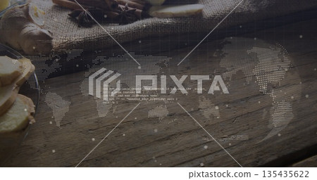 Floating dotted world map with code above pantry counter, showing ginger slices, star anise, burlap Floating dotted world map with code above pantry counter, showing ginger slices, star anise, burlap 135435622